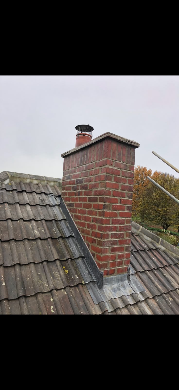 Brick chimney with lead flashing from TJS Roofing Solutions